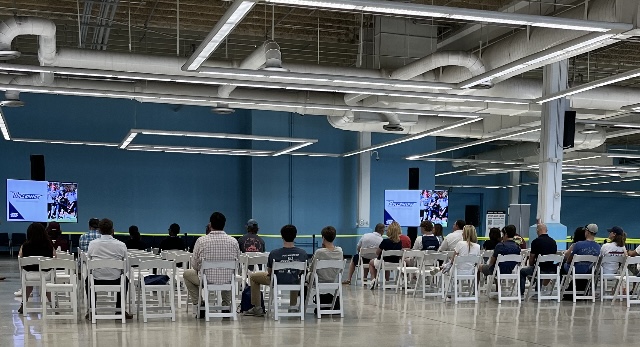 students listen to a lecture and power point