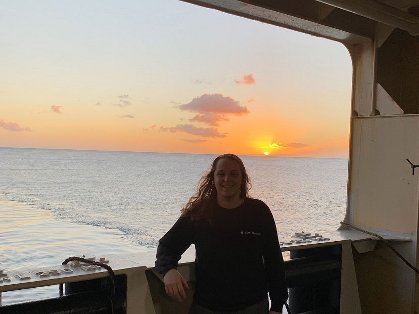 page on ship at sunset