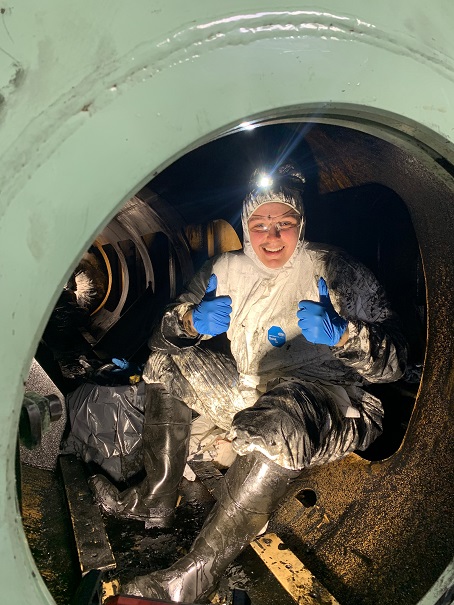 Paige cleaning the engine room