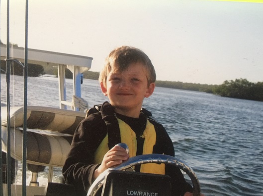 young Quinten on a boat