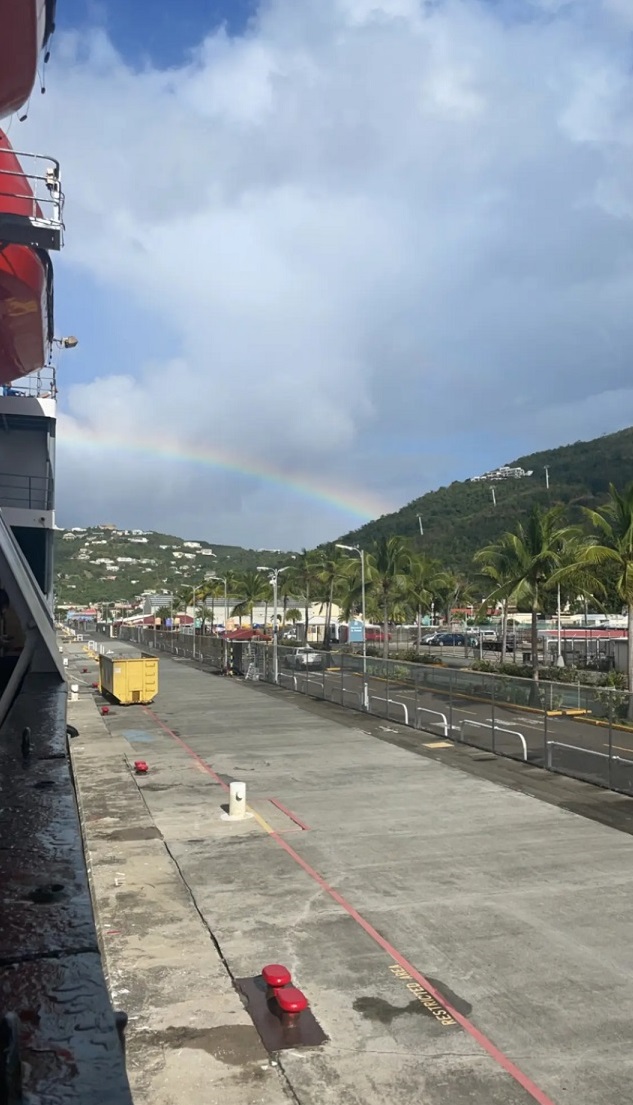 rainbow over land and water