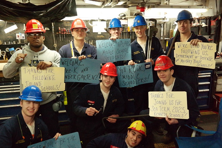 cadets hold thank you signs
