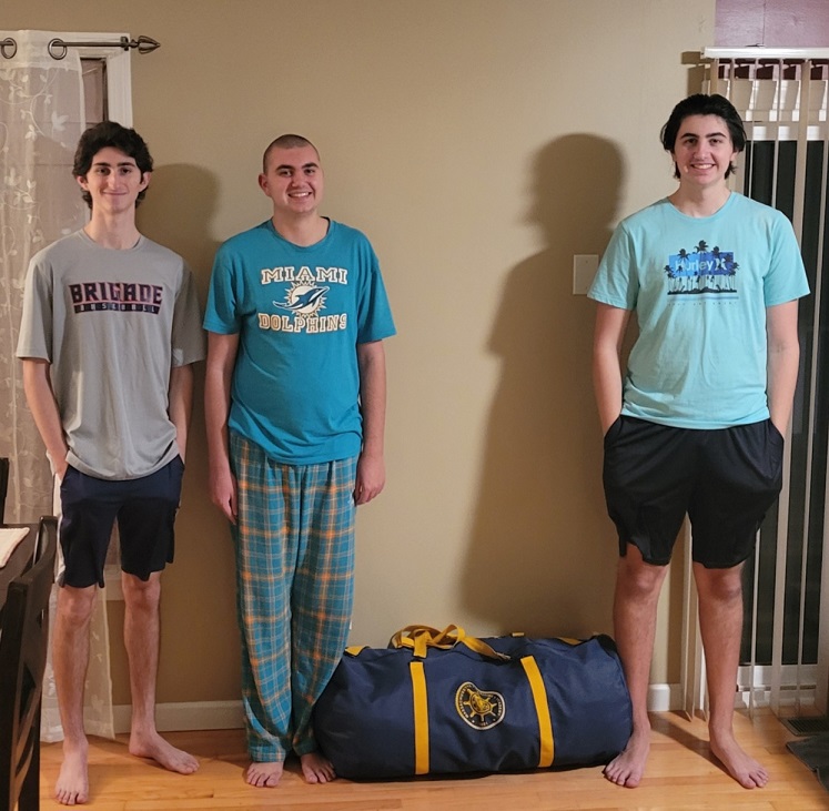 family with zipped bag