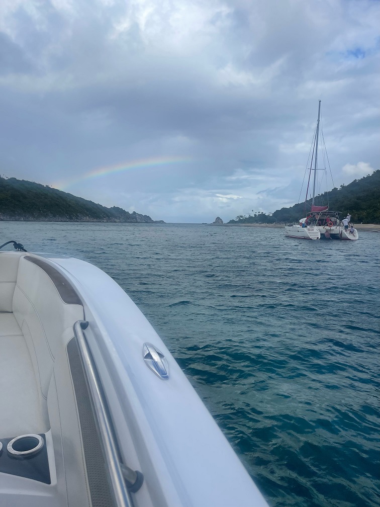 rainbow over land and water