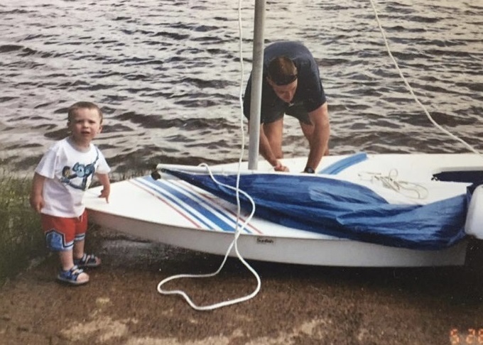 baby sam and his dad with a sailboat