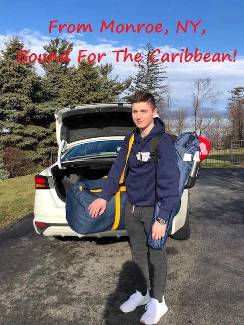 Cadet holding sea bag by car