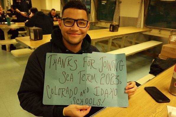 cadets hold thank you signs