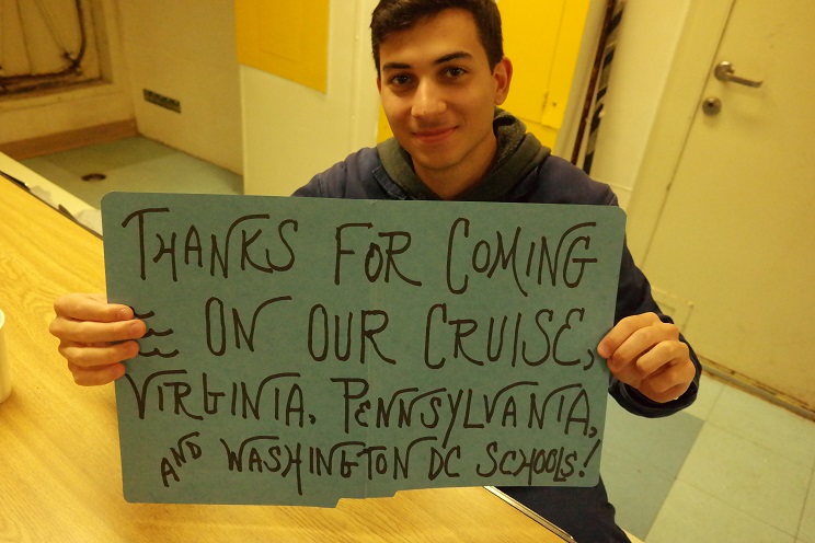 cadets hold thank you signs