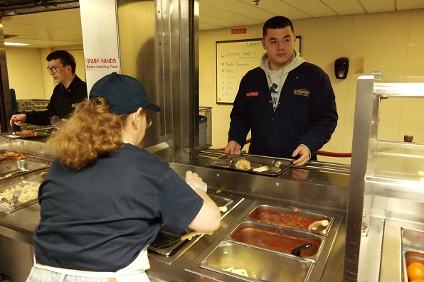cadets getting food in Mess Deck