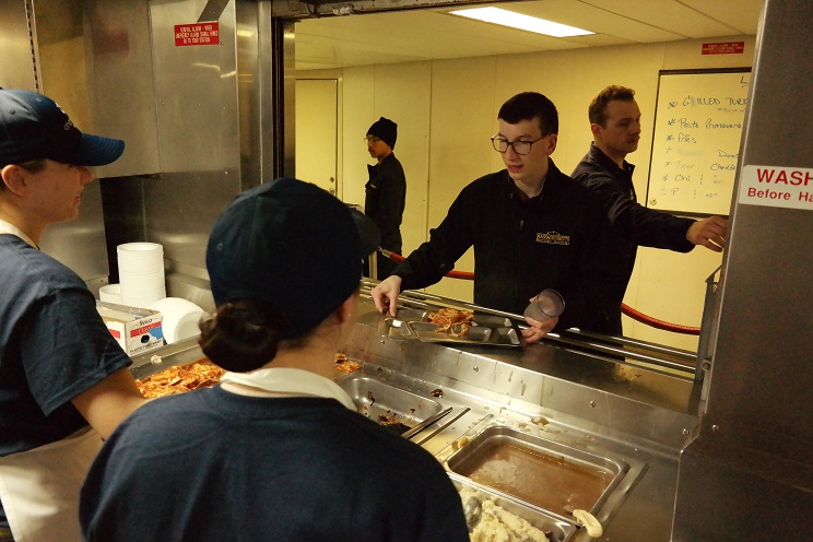 cadets getting food in Mess Deck
