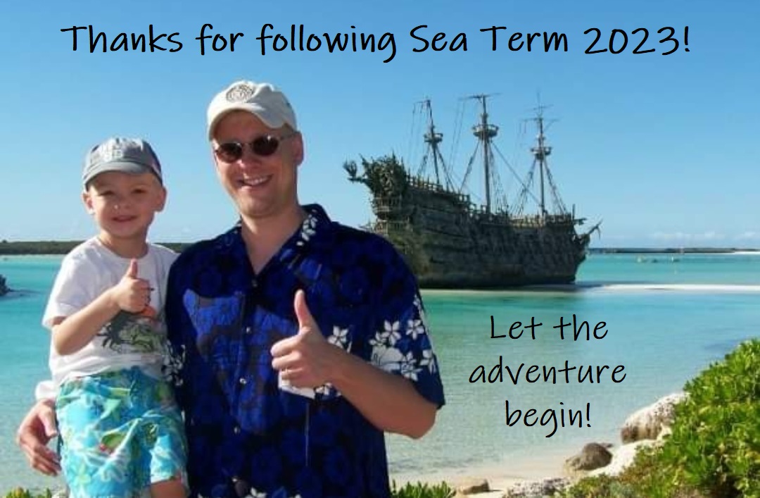 Jacob and his dad in front of a pirate ship.