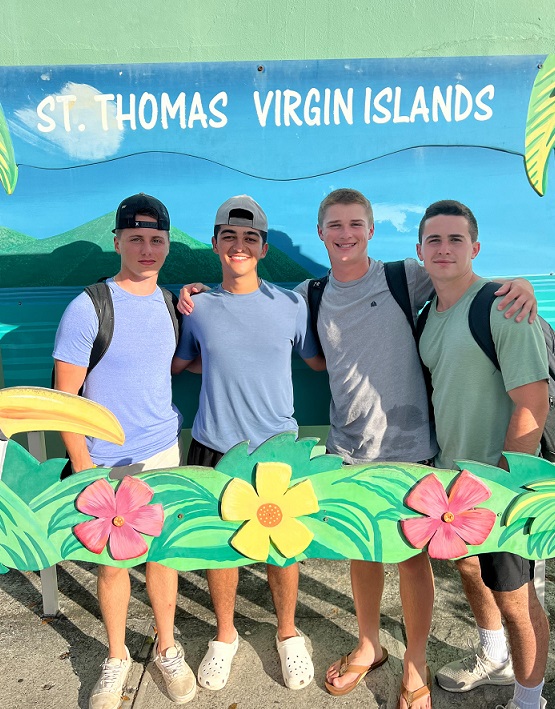 four cadets by welcome sign