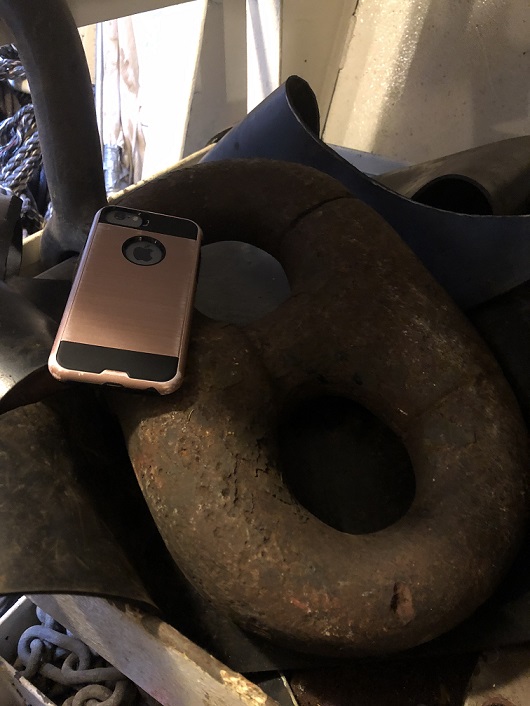 anchor chain link with cell phone on it