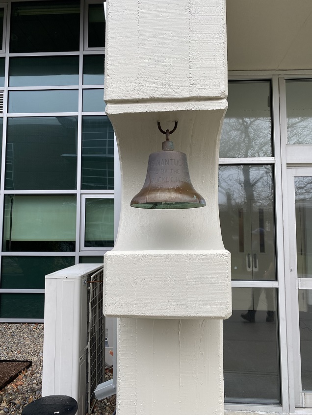 bell hanging outside of Harrington Building