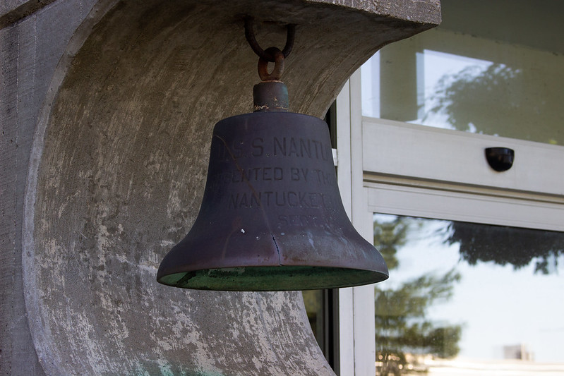 bell hanging outside of Harrington Building