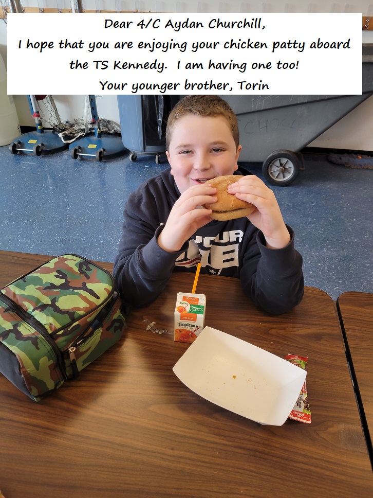 young students eat chicken patties