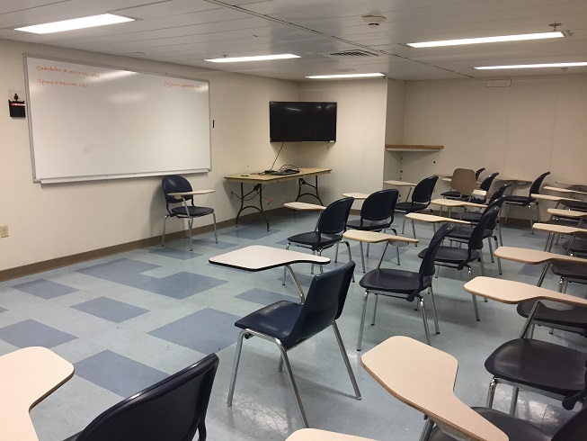 classroom with chairs and white boards