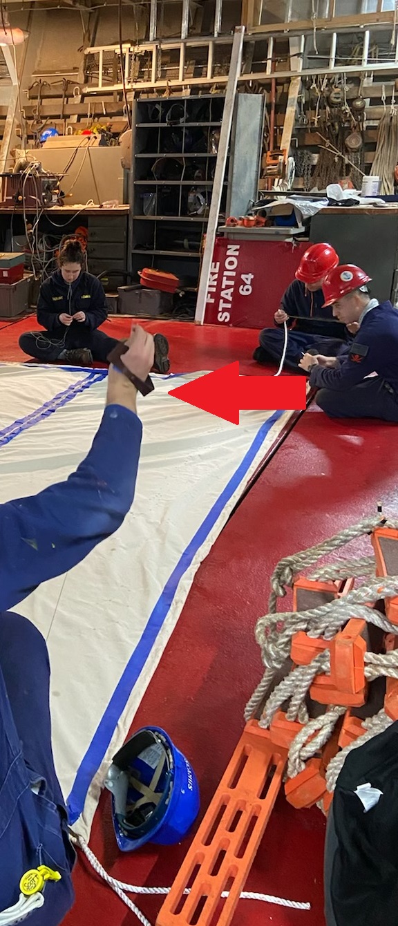 close up of cadets sewing canvas