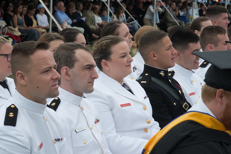 commencement grads sitting