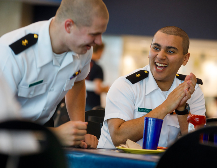cadets laughing in the dining hall