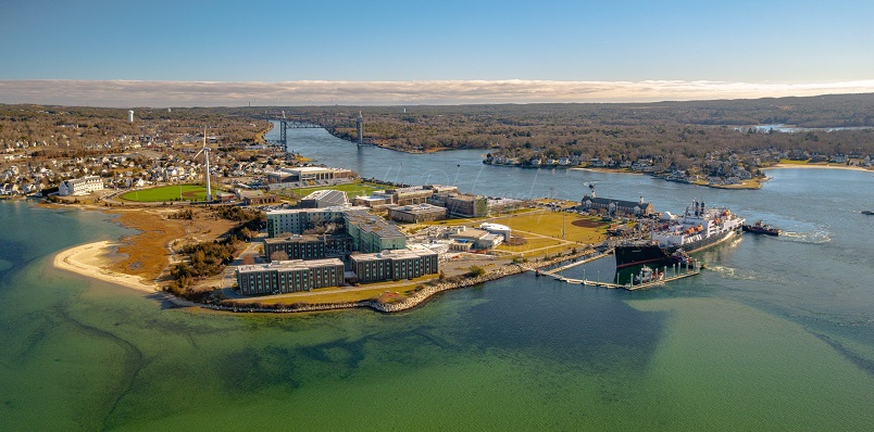 drone shot down to Kennedy, campus, and canal