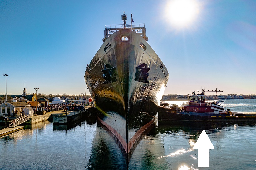 tug pushes training ship