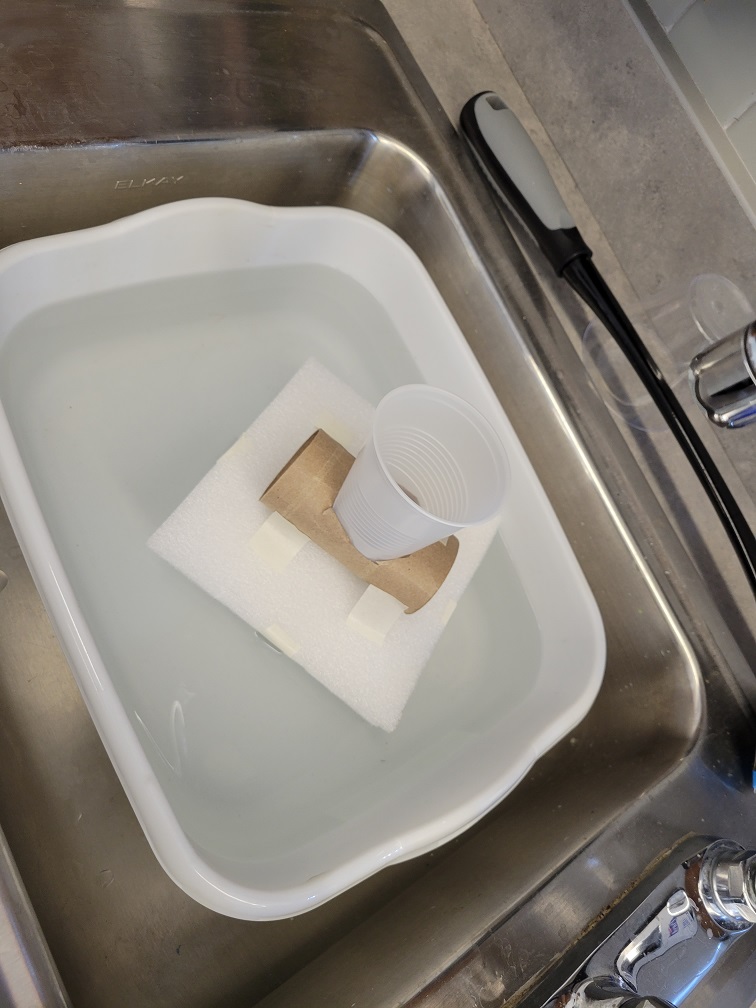 testing of student lifeboat in basin of water