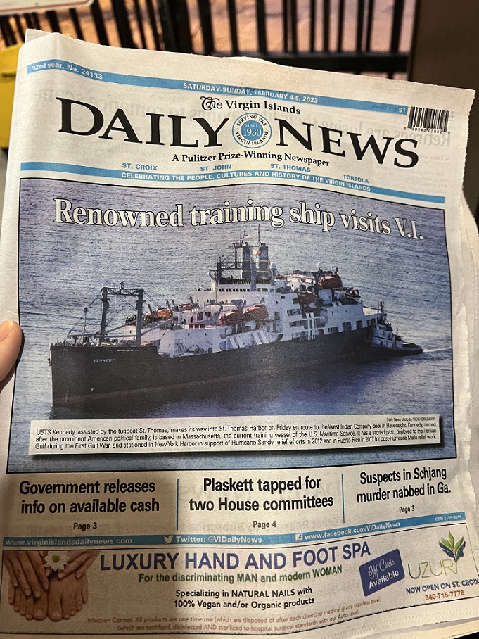 newspaper with ship on front page