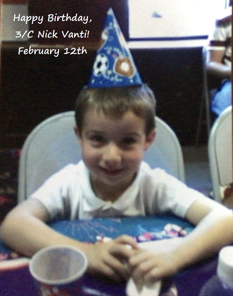young boy with party hat