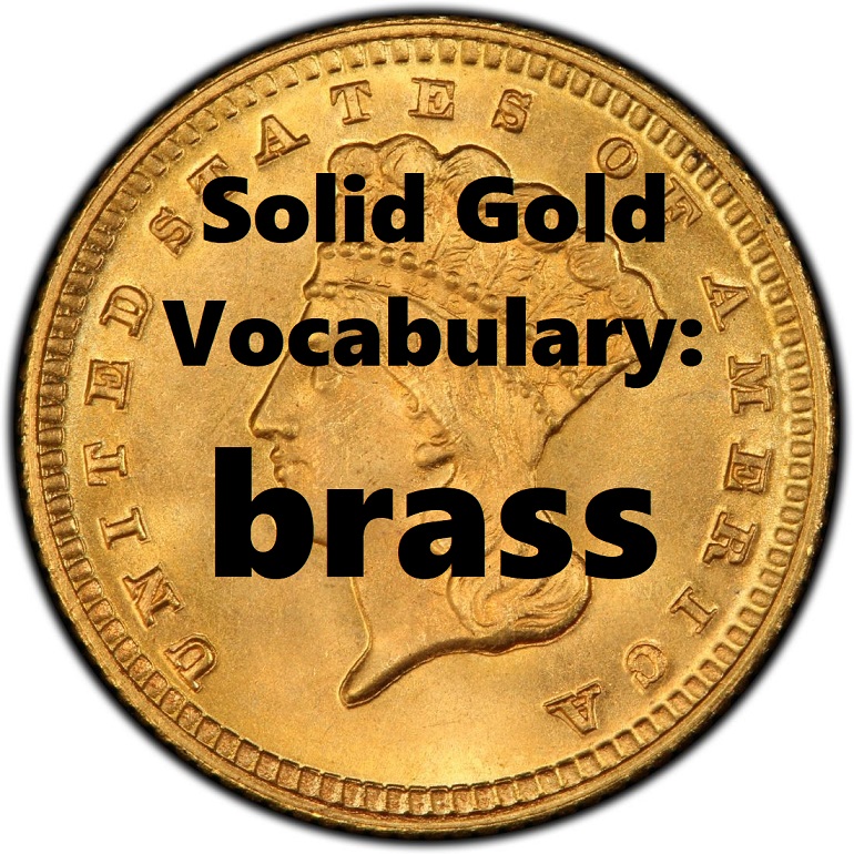 gold coin with word brass