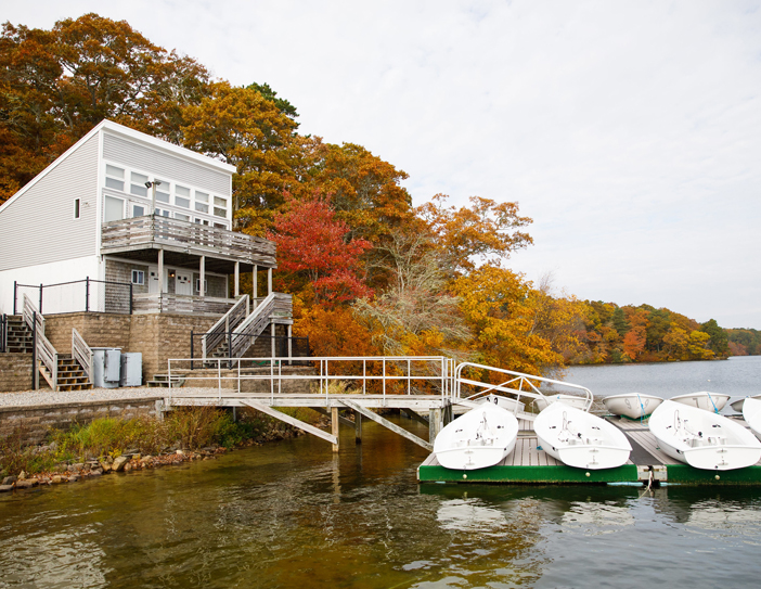 pond with building and boats