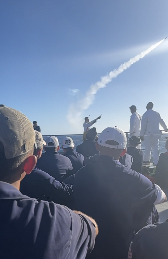 cadets on Helo deck watch pyrotechnics