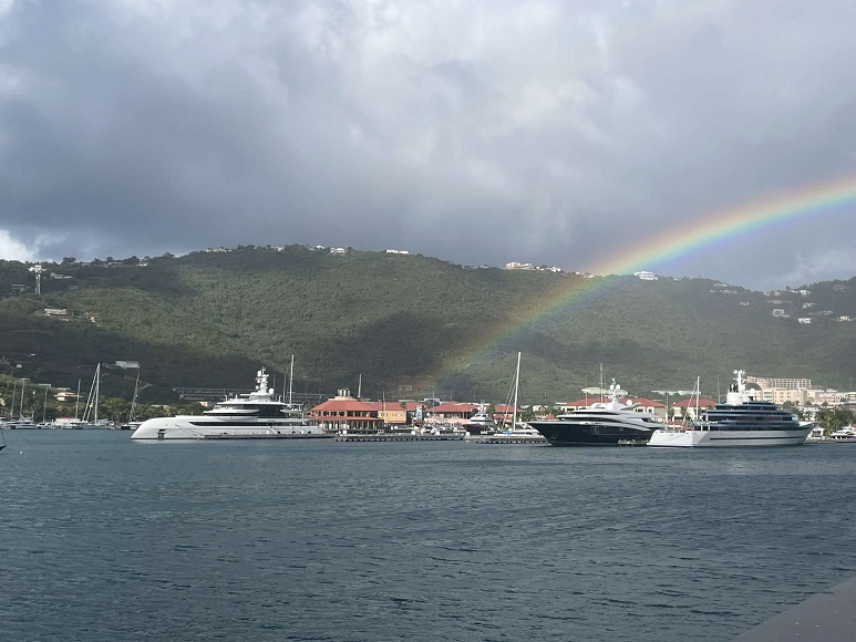 rainbow over land and water