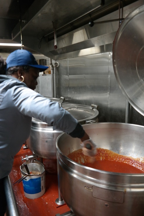 woman stirring sauce