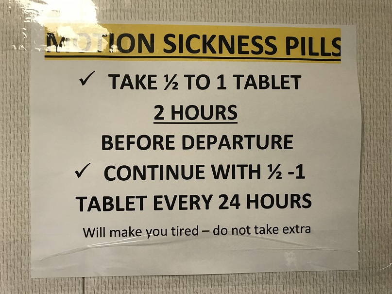 closeup of sign about seasickness pills