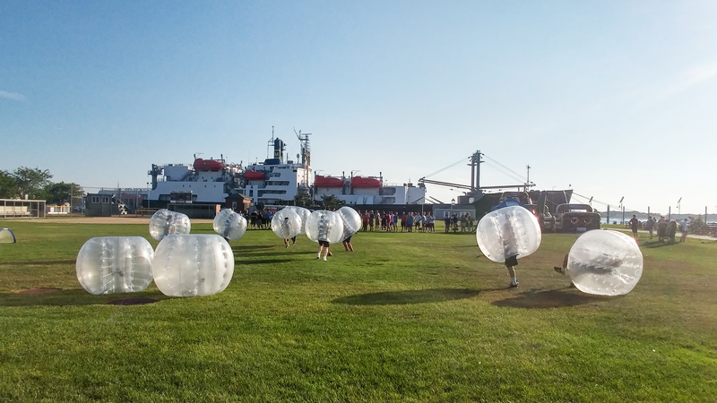 campers playing in giant bubbles on our field