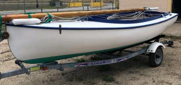 1 broadside of port side white hull with blue accents