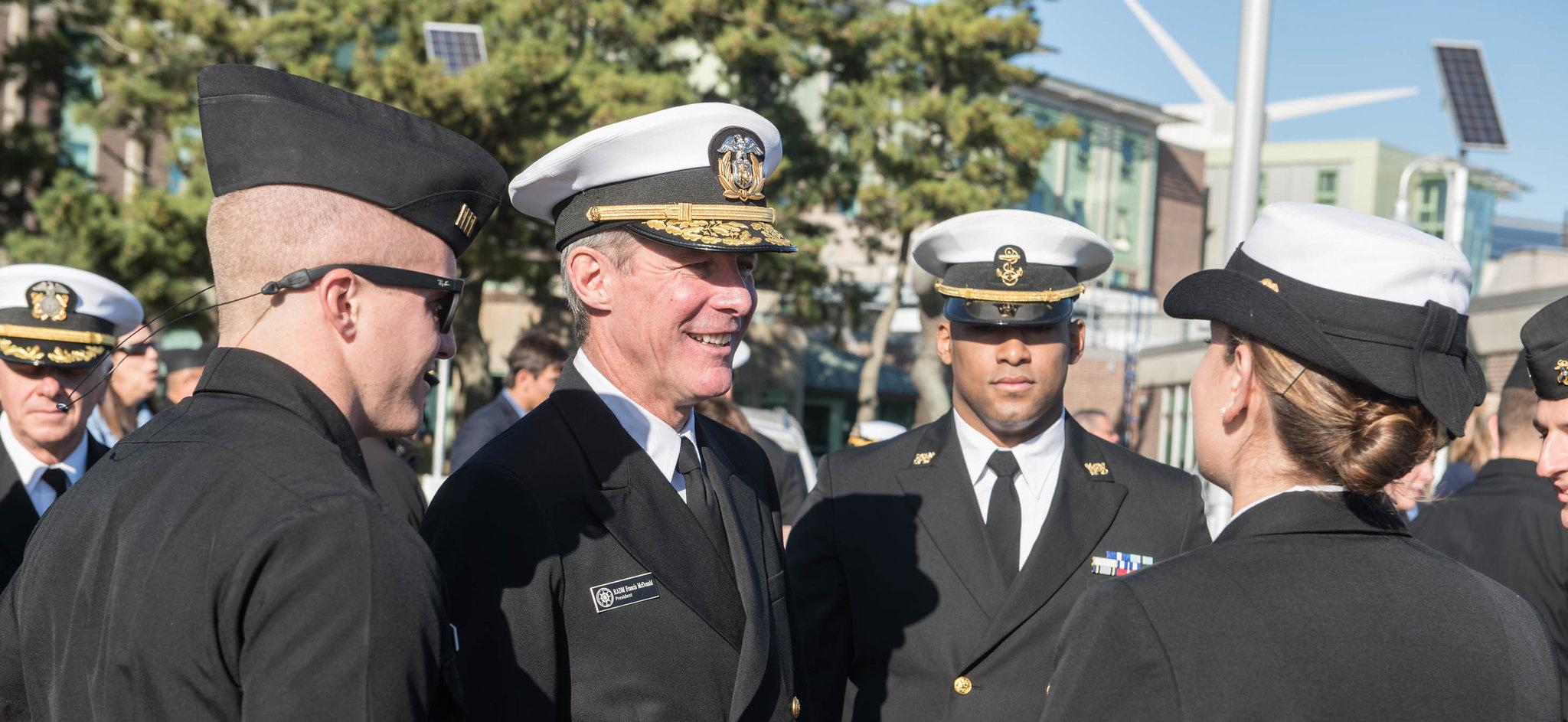 President Mcdonald with students in uniform