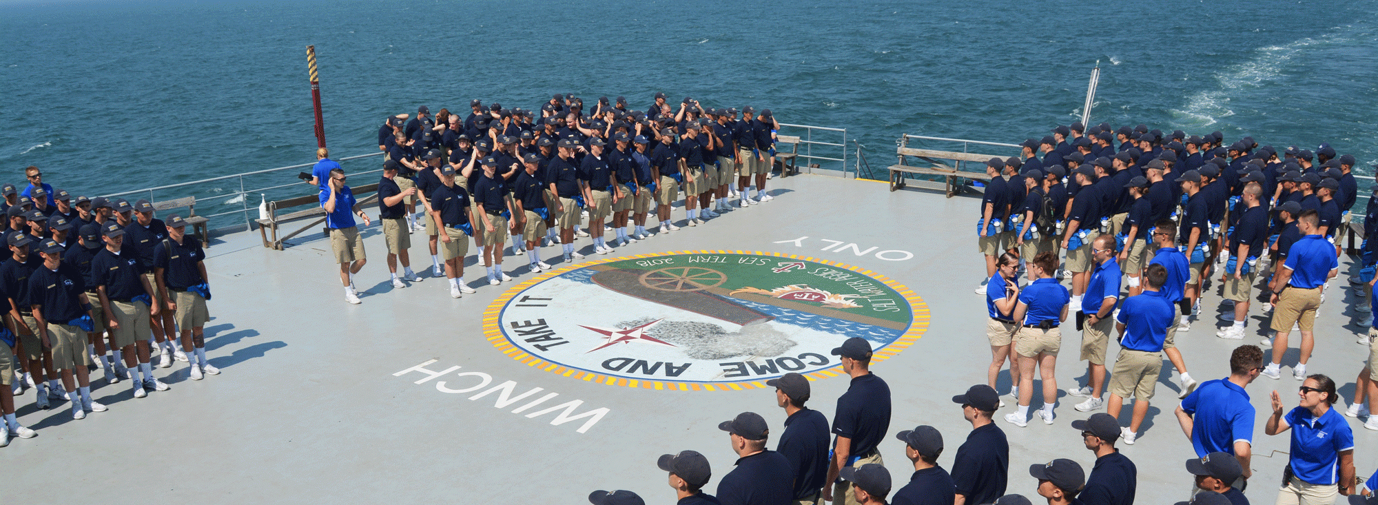 Cadets on the helo deck of the ship on sea term