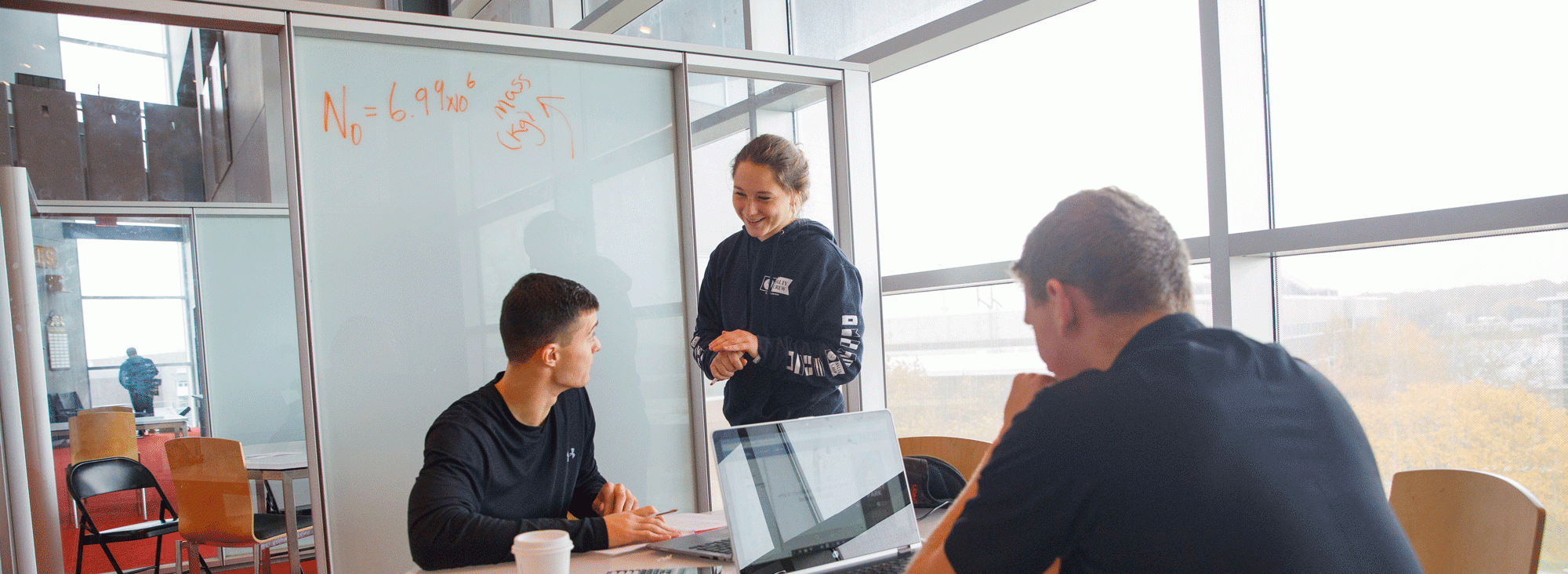 students getting tutored in the library