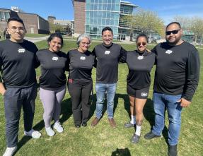students and staff matching shirts
