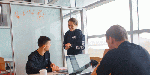 students getting tutored in the library