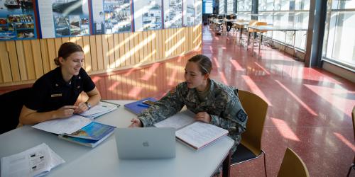cadets in library, one in camo