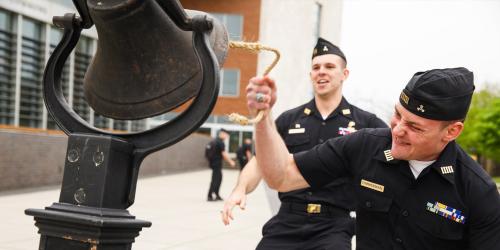 cadets ringing the bell after coast guard exams